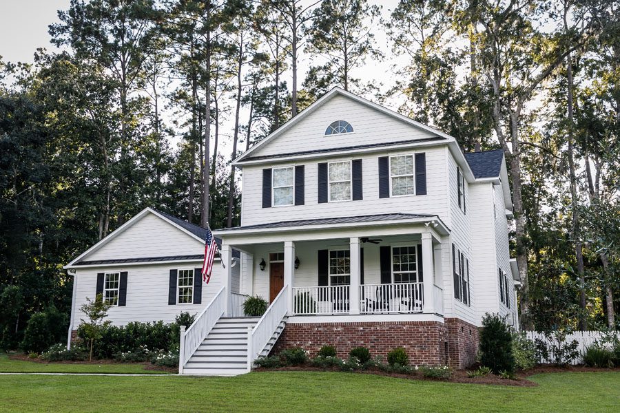 Personal Insurance - Modern Southern White Home with an American Flag in the Front of the Home